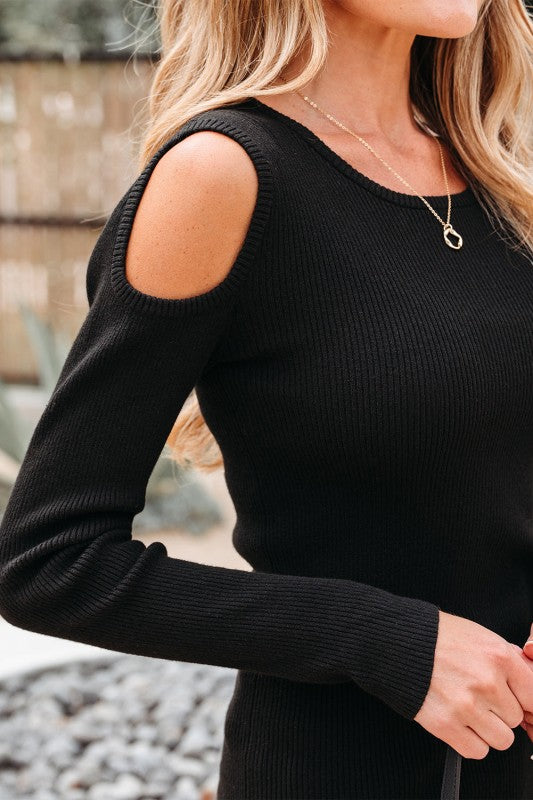 Close-up of cold shoulder cut-out and ribbed knit texture.
