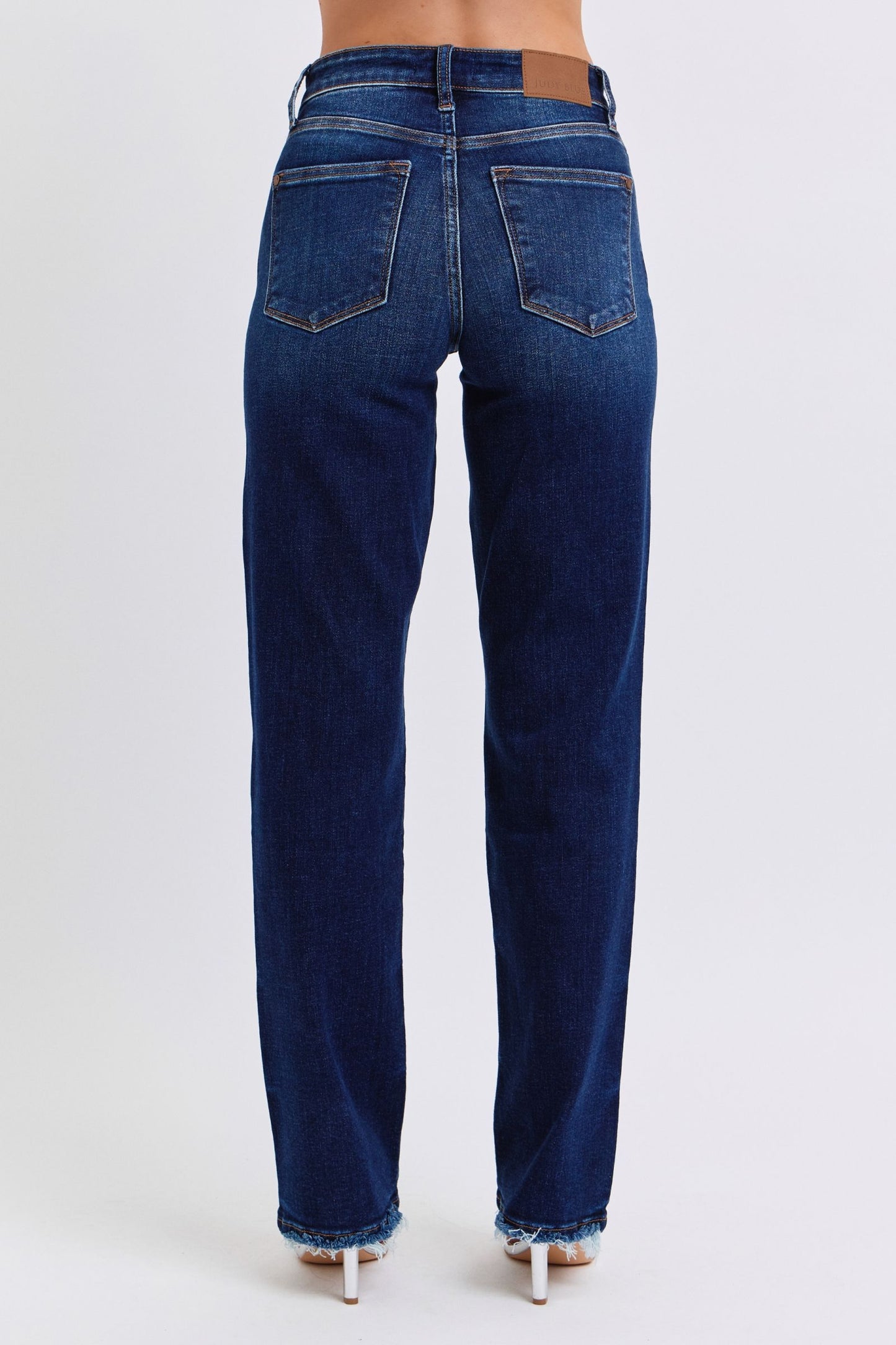 Judy Blue Polly Raw Hem Straight Leg Jeans in dark wash, featuring a mid-rise waist, raw hem, and slightly stretchy fit for a versatile, stylish look.