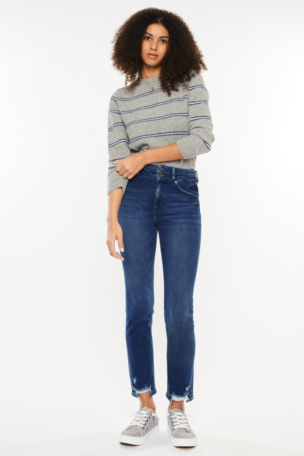 Dark high-rise slim straight jeans with a slightly stretchy fit, raw hem, and pockets.