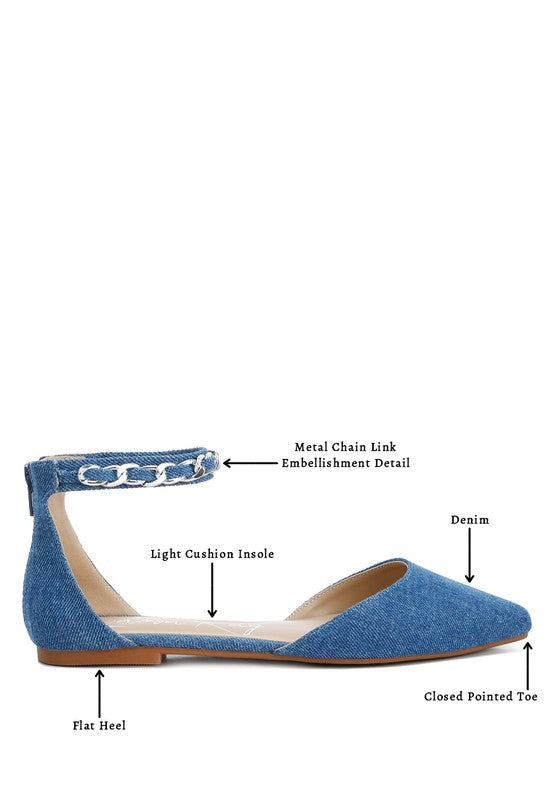 Denim flats with a pointed toe, chain ankle strap, and flat heel .