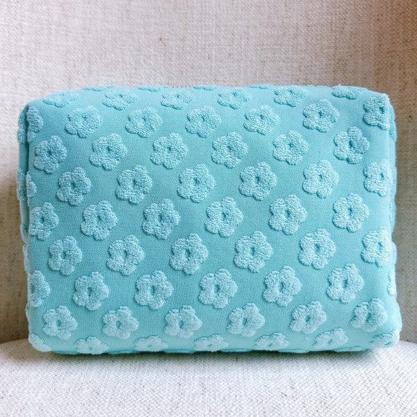 Mint Blue Embossed Daisy Blossom Cosmetic Case with embossed floral pattern.