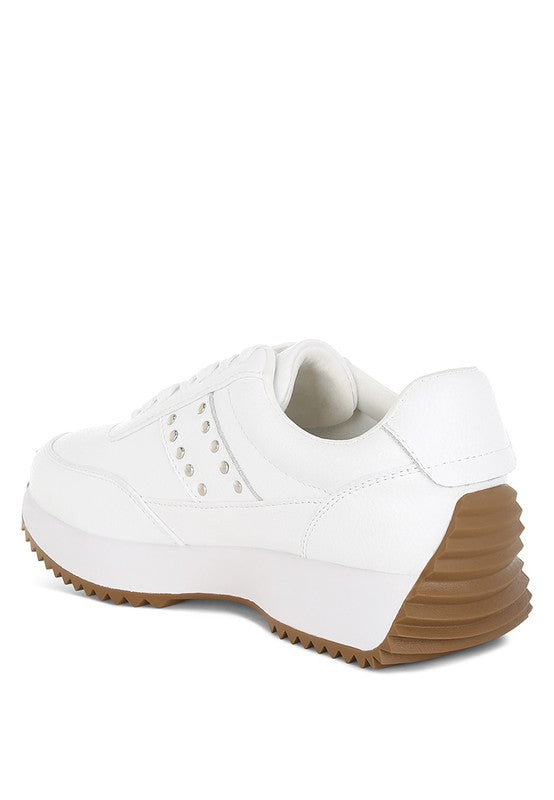 Back angle of white Athion Studded Leather Sneakers with gum sole detail