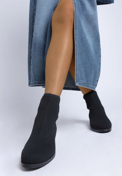 Top view of black Rosamund Sock Boots with cushioned insole and soft textile finish.