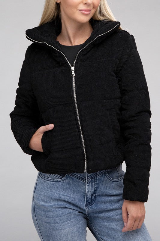 Black corduroy zip-up jacket with a high collar, long sleeves, and a pocket.