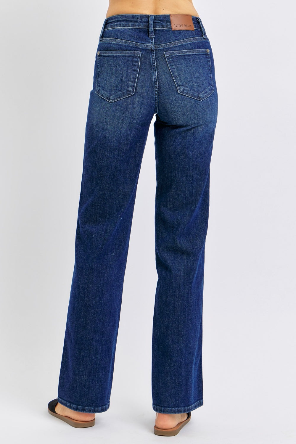 High-waist straight-leg jeans with tummy control, moderate stretch, and a washed finish.