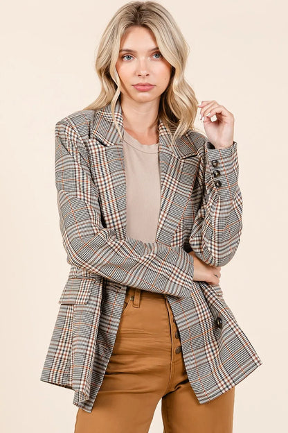 Front view of unbuttoned Lennon Plaid Blazer styled casually with brown jeans