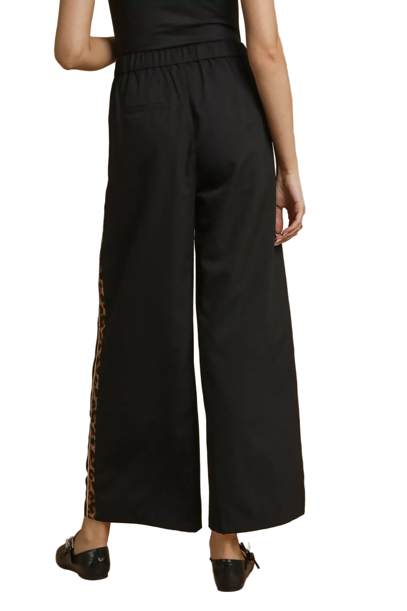 Back view of Cedar pleated pants with wide-leg silhouette