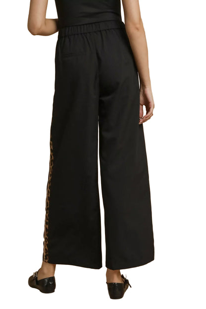 Back view of Cedar pleated pants with wide-leg silhouette