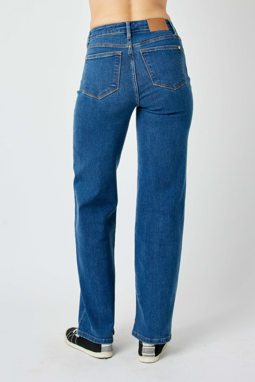 Judy Blue high-rise straight leg jeans in a medium wash with moderate stretch.