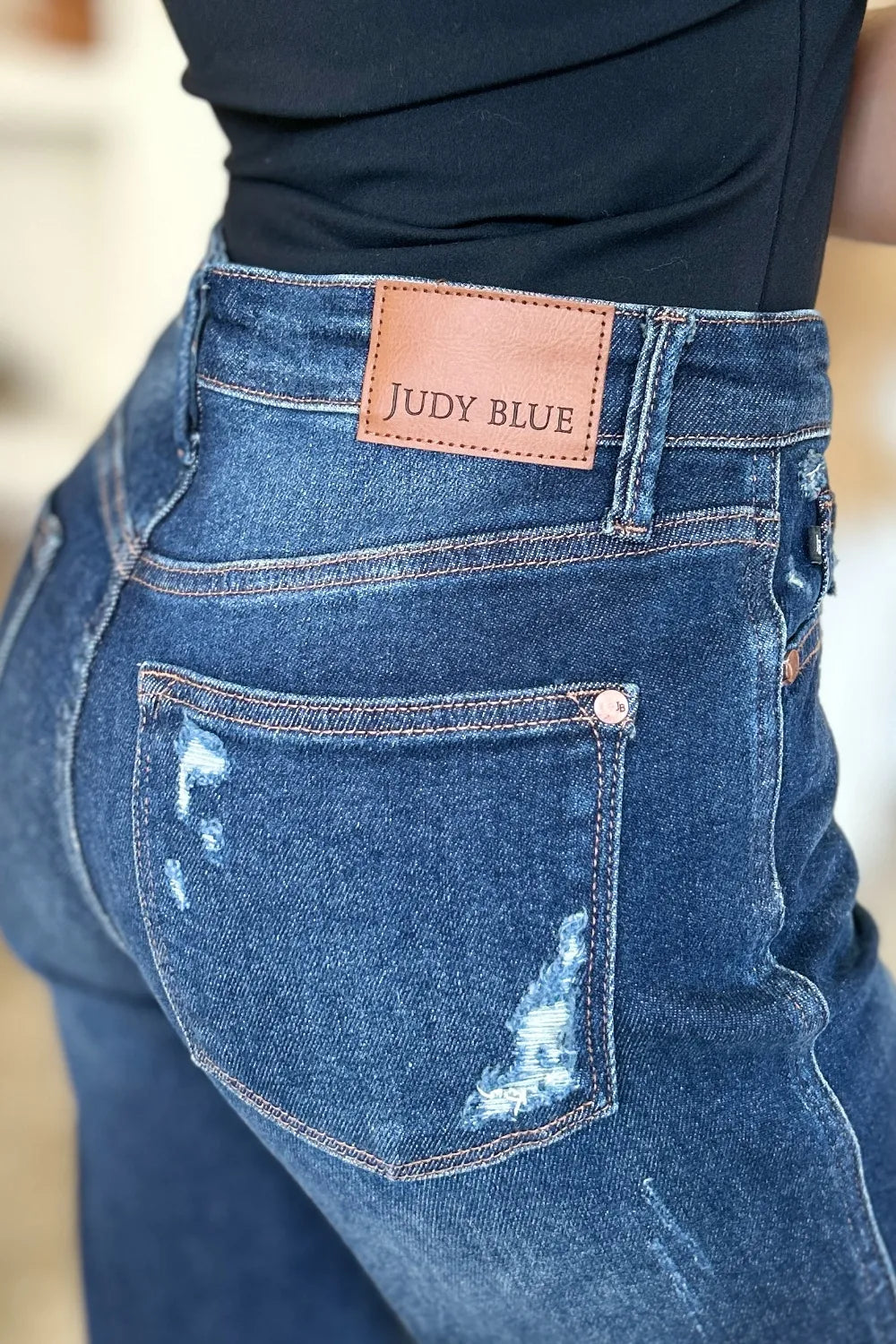 Detail of Wynna Jeans back pocket with Judy Blue logo tag and distressed design