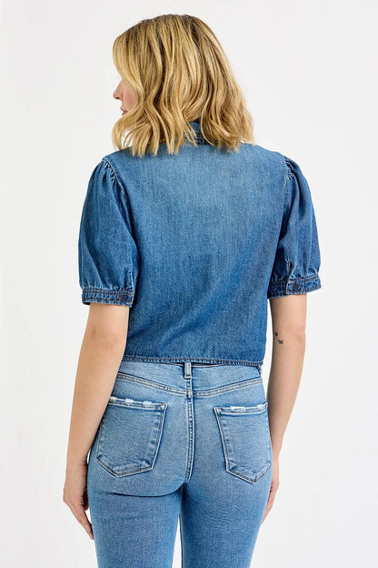 Back view of Alexa button-down crop denim shirt with short puff sleeves in medium wash.
