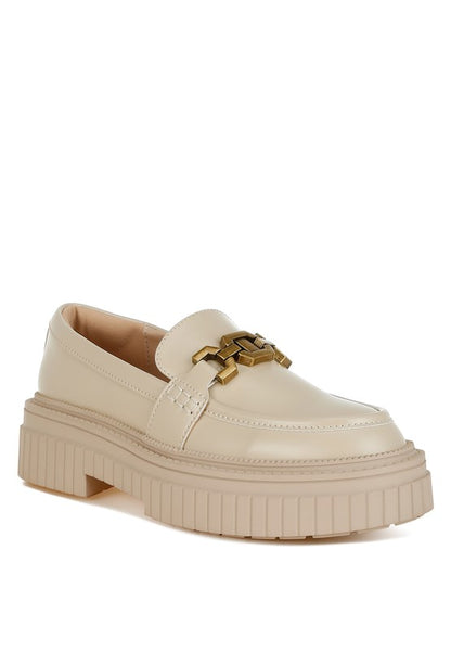 Front angle of beige Grosbeak Horsebit Chunky Loafers with gold chain.