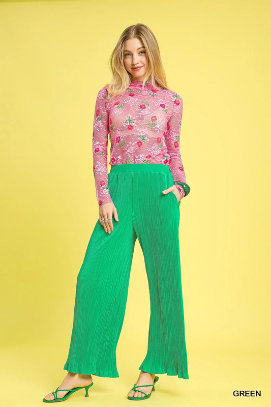 Model in Hadlee green textured pants, wide-leg high-waist cut with breezy ankle length.