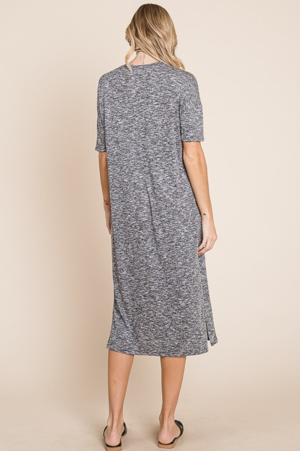 Grey midi dress with a round neck, half sleeves, and a slit detail.