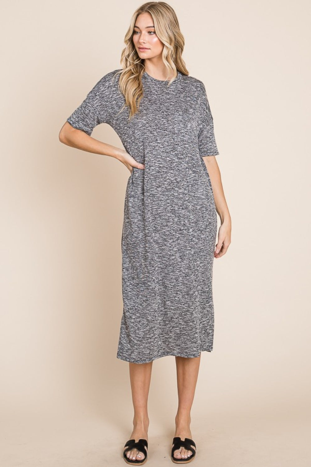 Grey midi dress with a round neck, half sleeves, and a slit detail.