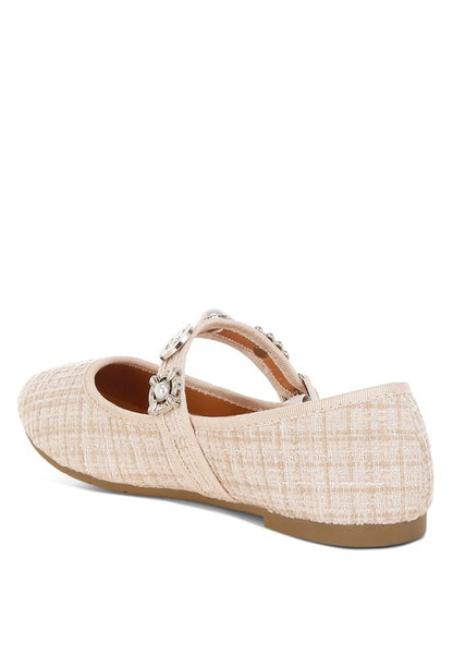 Inside back angle view of beige Noyama Tweed Mary Jane flats highlighting the textured tweed fabric and charm embellishments.