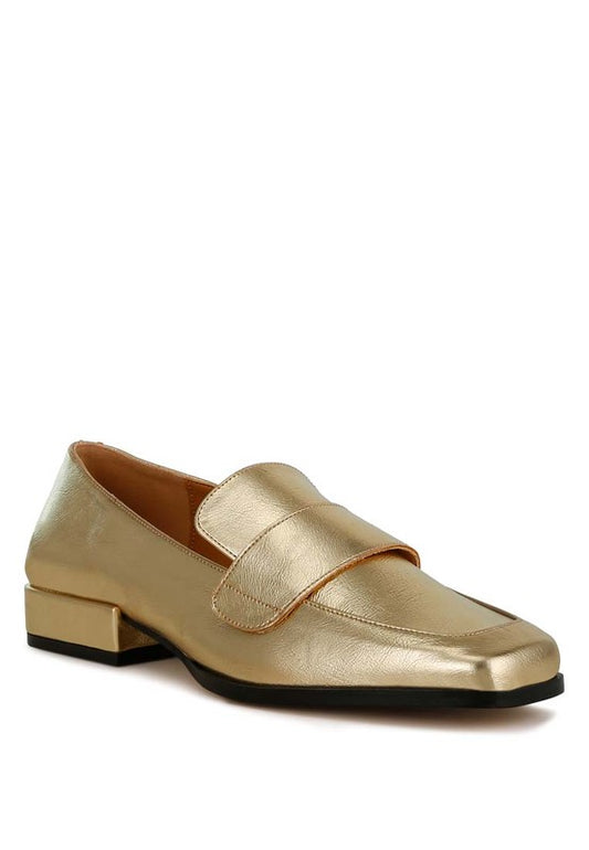 Front angle view of gold Jovana metallic penny loafers with square toe and strap detail.