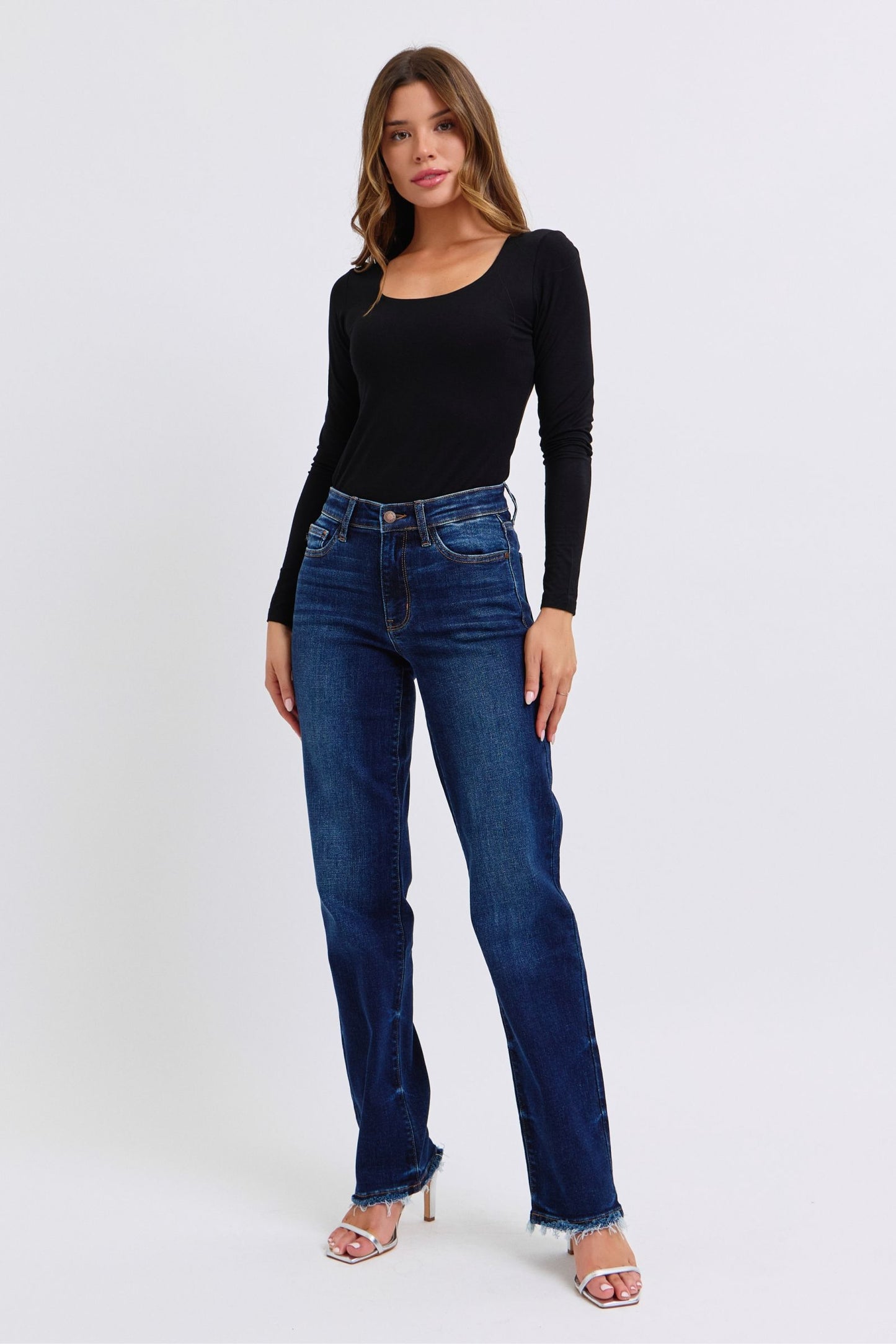 Judy Blue Polly Raw Hem Straight Leg Jeans in dark wash, featuring a mid-rise waist, raw hem, and slightly stretchy fit for a versatile, stylish look.