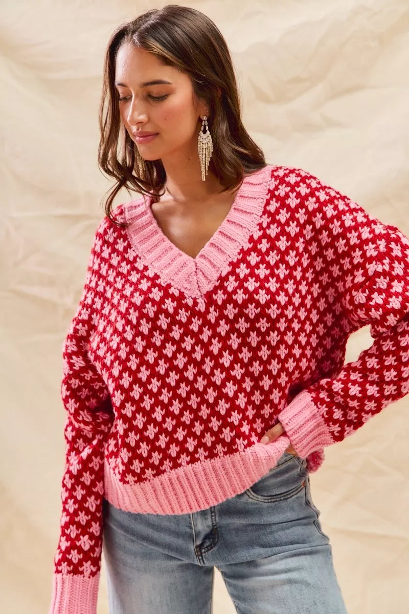 Cozy Chloe V-neck sweater in red and pink, relaxed oversized knit front pose.