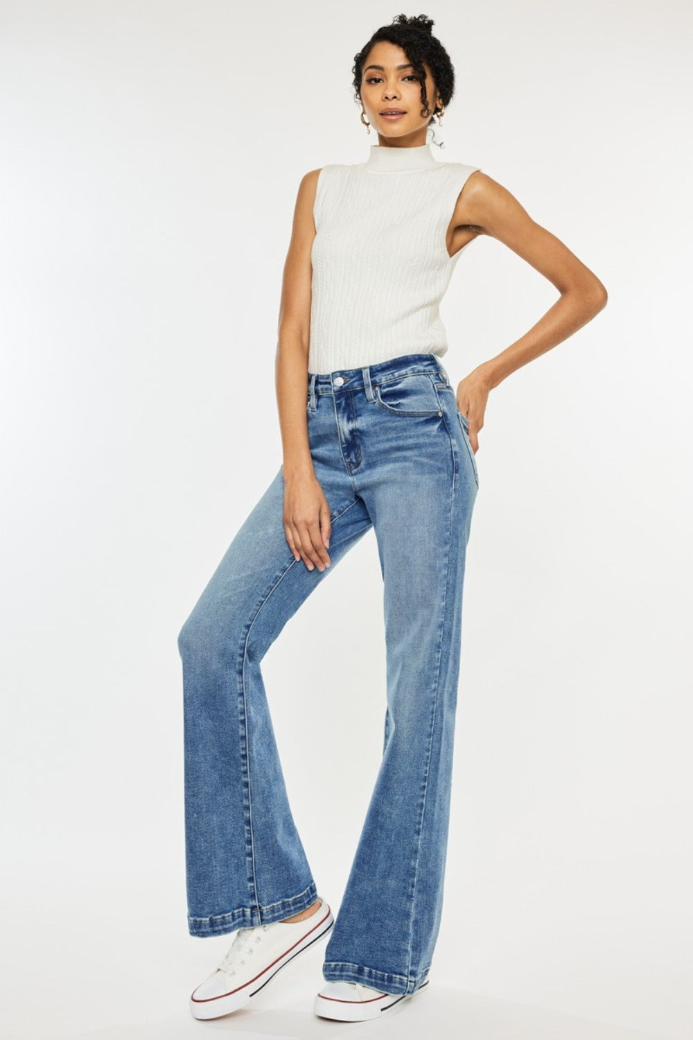 High Rise Wide Leg Jeans in medium wash by Kancan. Slightly stretchy denim with classic 5-pocket design, regular hem, and zipper fly. Versatile wide-leg flare silhouette.