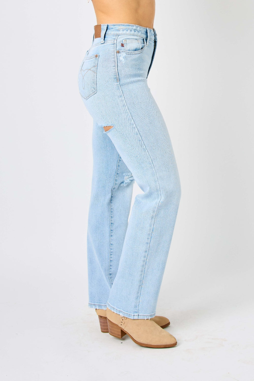 High waist distressed straight jeans in light wash. Slightly stretchy with a zip fly closure.