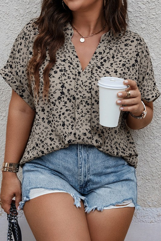 Ruthie Plus Size Floral Blouse front view with notched V-neck and relaxed short sleeves.