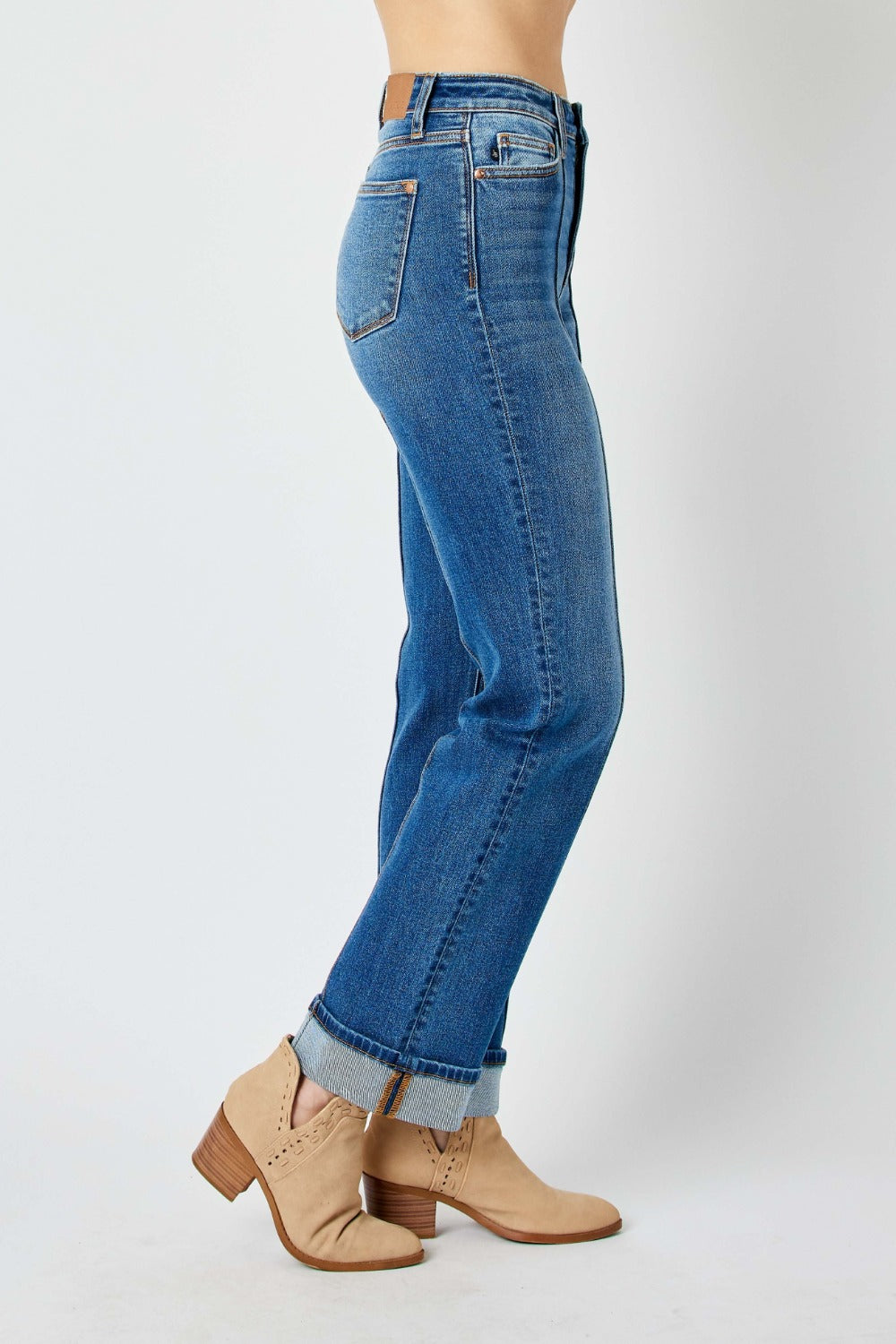 Medium wash high-waist straight-leg jeans with front seam detail and moderate stretch.