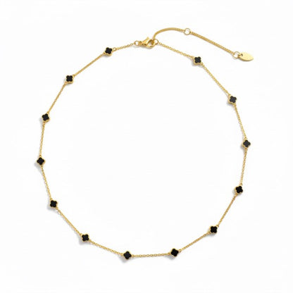 Close-up of Petite Colored Clover Necklace pendant symbolizing luck and elegance.