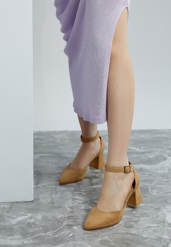 Close-up of woman wearing beige Rozita Block Heels focusing on buckle strap and pointed toe