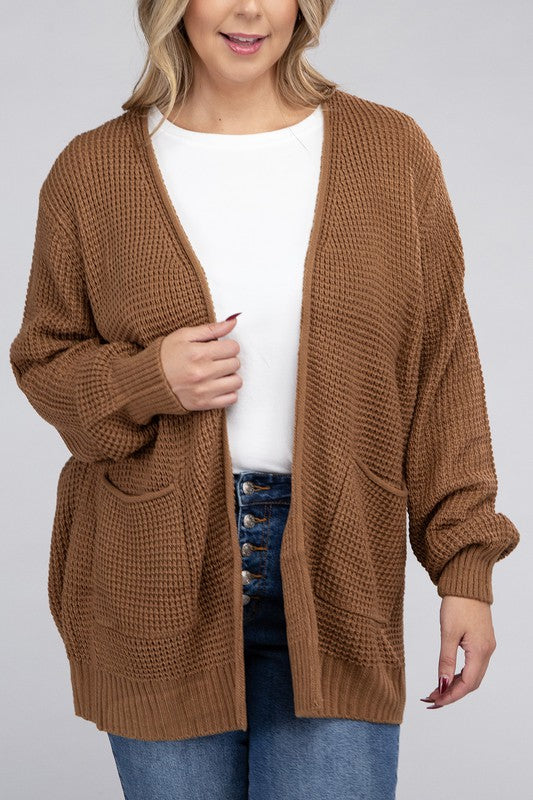 Curvy plus-size waffle-pattern open cardigan sweater in deep camel, with long sleeves, oversized fit, and pockets.