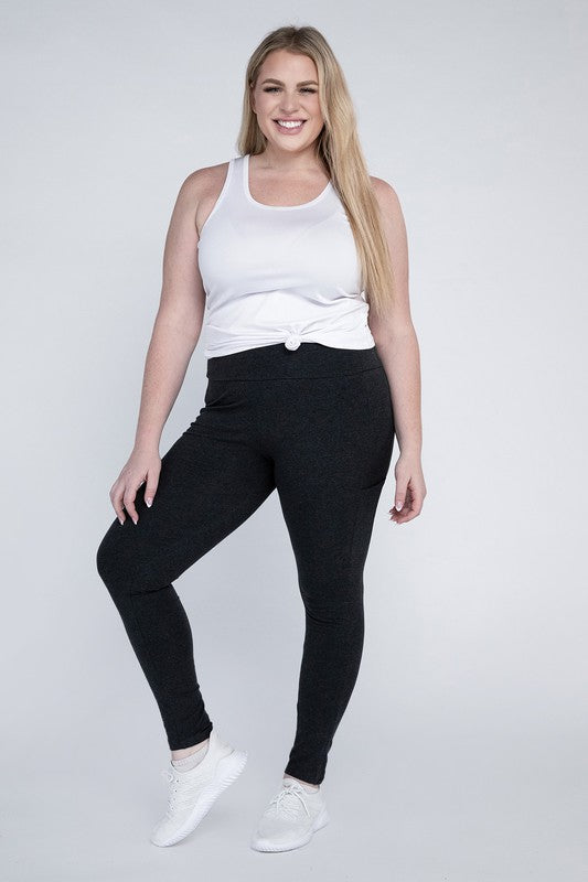 Full-length curvy plus leggings in charcoal with a high-rise thick waistband, fitted silhouette, and convenient leg pockets.