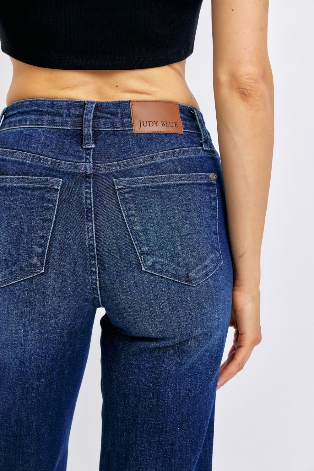 High-waist straight-leg jeans with tummy control, moderate stretch, and a washed finish.