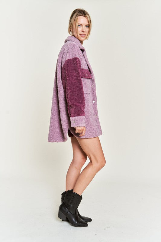 Deedre Sherpa Jacket in berry, side full body view styled with shorts and boots.