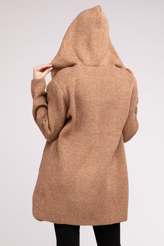 Deep camel sweater cardigan with long sleeves, front pockets, and a hooded neckline. 