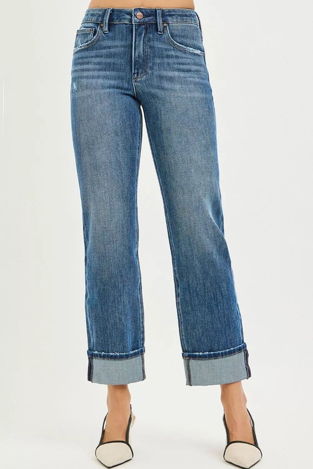 Model wearing Cara 4 Way Stretch Slouchy Straight Jeans in dark wash with cuffed hem and high waist.