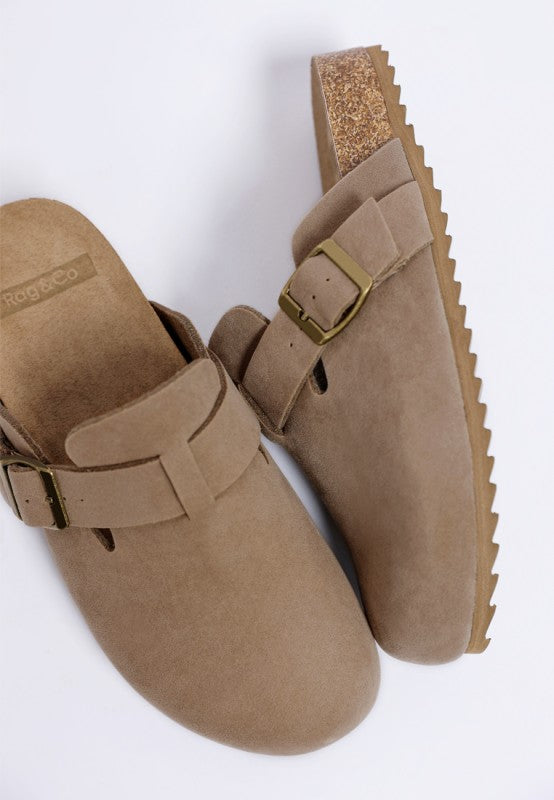 Taupe Ratiha Mules top view and tilted side showing gold buckle, faux suede, cork midsole, and tread sole.
