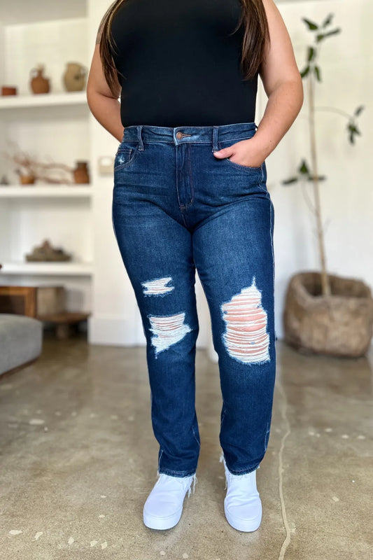 Plus size model wearing Wynna High Waist Straight Jeans, heavy distressing and raw hem
