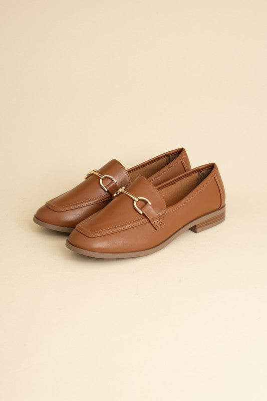 Cognac Horsebit Loafers with guitar motif, featuring horsebit detailing, slip-on style, and flat heel.