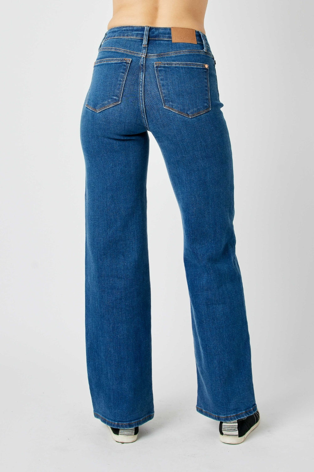 Judy Blue high-rise straight leg jeans in a medium wash with moderate stretch.