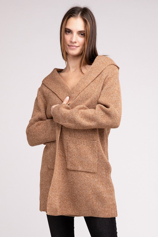 Deep camel sweater cardigan with long sleeves, front pockets, and a hooded neckline. 