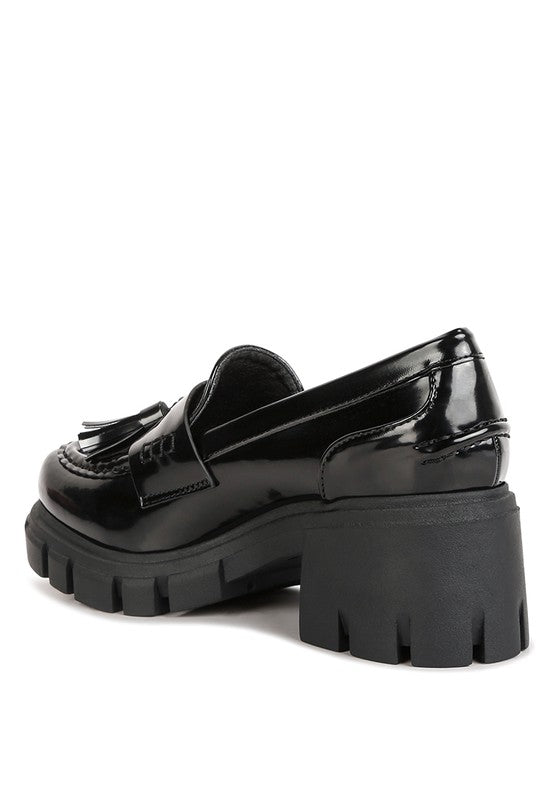 Back side angle view of Jonah Platform Loafers in black with lug heel design