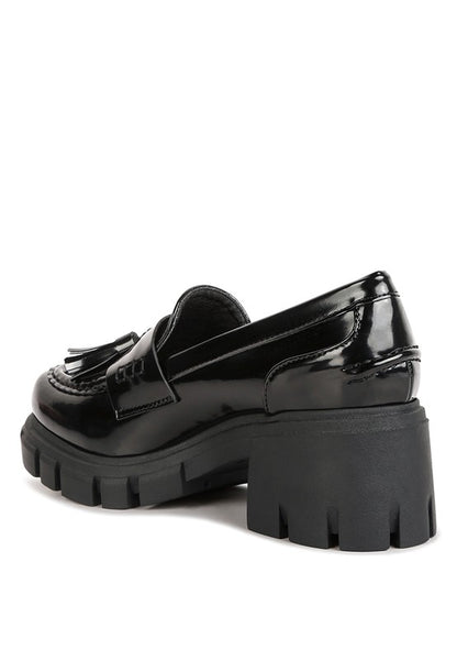 Back side angle view of Jonah Platform Loafers in black with lug heel design