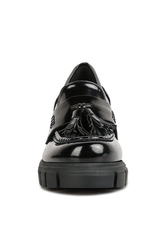 Front view of Jonah Platform Loafers in black with rounded toe and tassels
