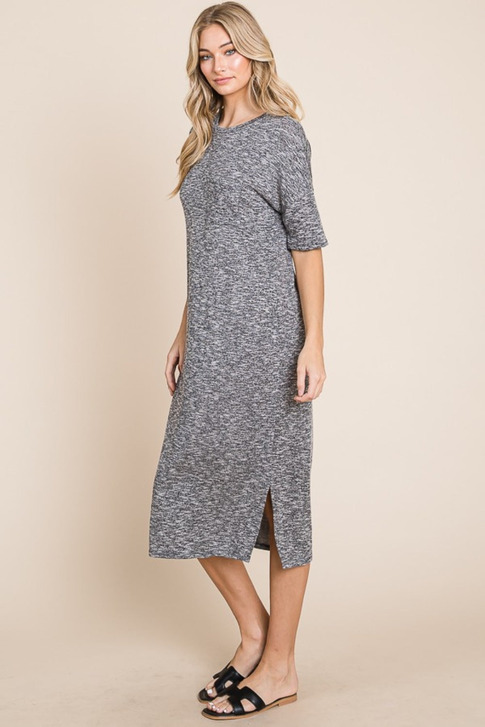 Grey midi dress with a round neck, half sleeves, and a slit detail.