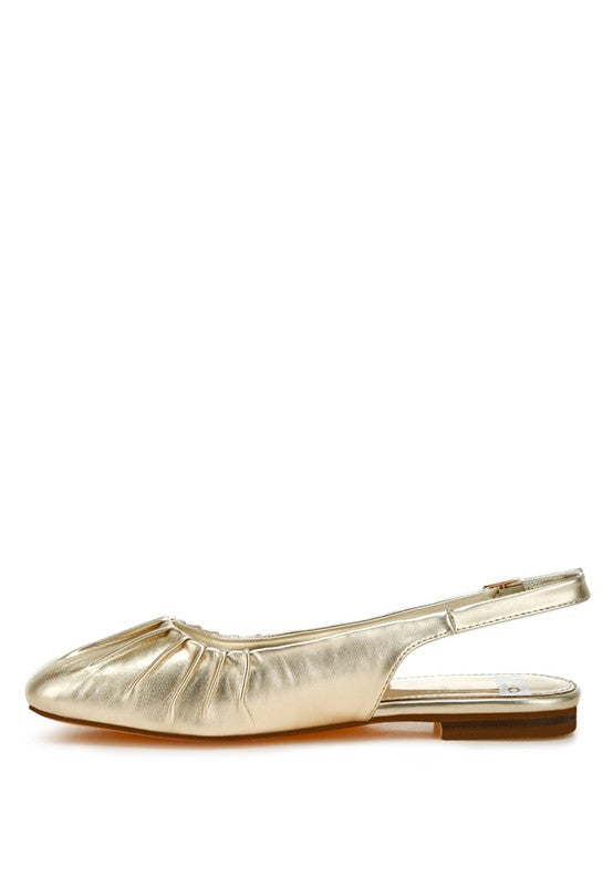 Metallic pleather flat slingbacks with a square closed toe, adjustable pin buckle strap, and cushioned insole, available in gold.