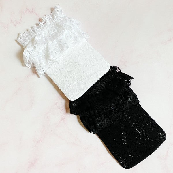 Folded black and white 80’s Lace Socks set showing lace pattern and soft stretch fabric.