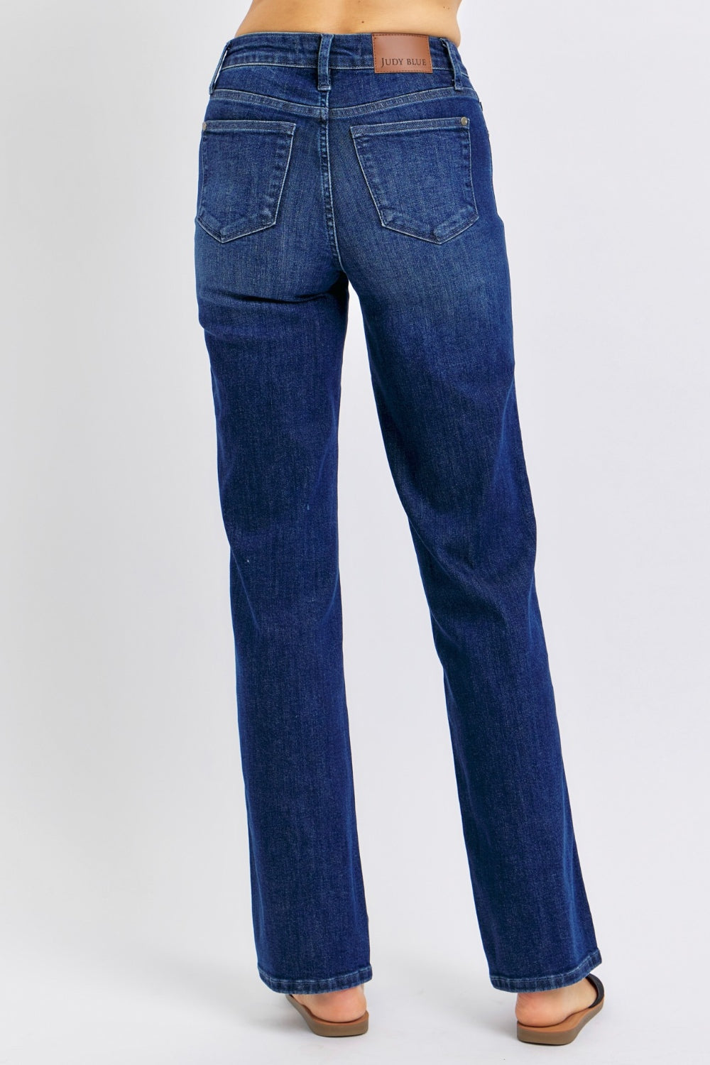 High-waist straight-leg jeans with tummy control, moderate stretch, and a washed finish.