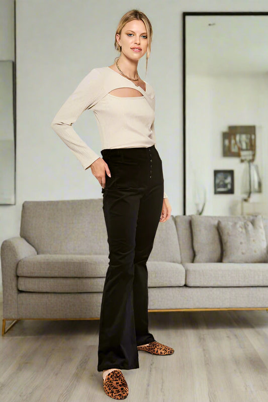 Full body view of Taran Corduroy Flare Pants in black with high waist and six-button fly