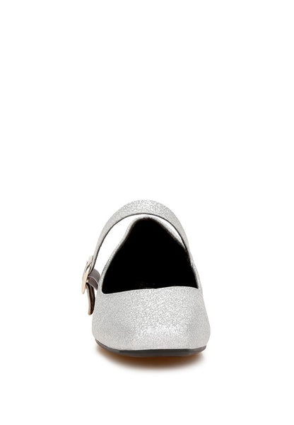 Front view of silver glitter flats with pin buckle strap and modern square toe.