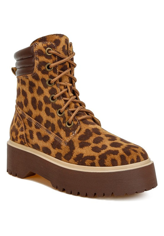 Leopard print high-ankle suede boots with a quilted collar, lace-up design, round closed toe, and low block platform heel. Features cushioned insoles and a durable lug sole.